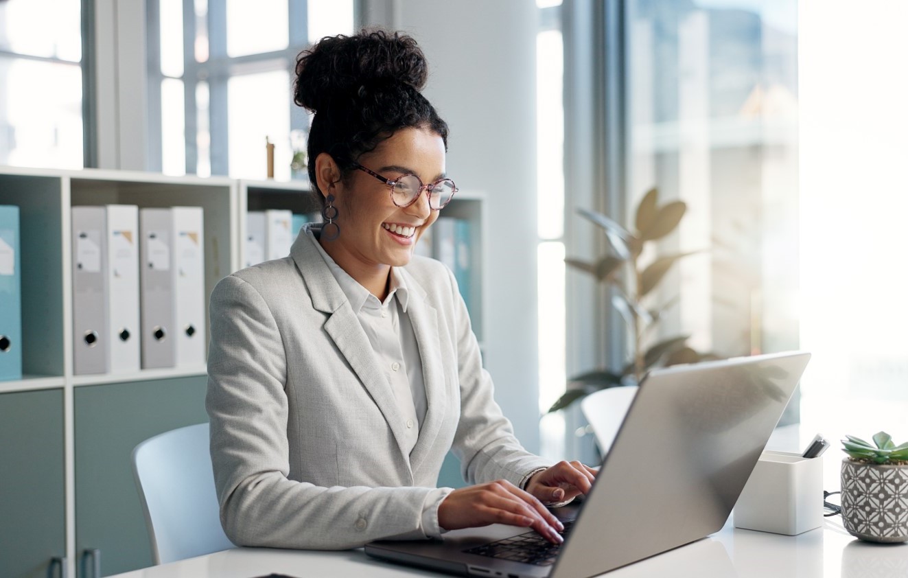 Woman typing in a laptop